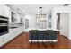 Modern kitchen with white cabinets, stainless steel appliances, and a large island at 4260 Hammond Bridge Dr, Suwanee, GA 30024