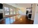 Bright living room with hardwood floors, large windows, a fireplace, and access to the patio at 4260 Hammond Bridge Dr, Suwanee, GA 30024