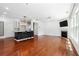 Open-concept living room with hardwood floors, fireplace, and natural light at 4260 Hammond Bridge Dr, Suwanee, GA 30024