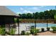Community pool with a black fence and lounge chairs at 4260 Hammond Bridge Dr, Suwanee, GA 30024