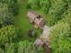 Aerial view of the home showing the landscaped yard, driveway, and surrounding trees at 4615 Gresham Rd, Douglasville, GA 30134