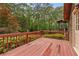 The back deck provides a serene outdoor space surrounded by lush trees and greenery at 4615 Gresham Rd, Douglasville, GA 30134