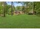 Spacious backyard with lush green grass, perfect for recreation and enjoying nature at 4615 Gresham Rd, Douglasville, GA 30134