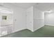 Basement area with doorway leading to patterned floor kitchen space at 4615 Gresham Rd, Douglasville, GA 30134