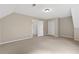 Spacious room with neutral carpeting, closet space, and access to other rooms at 4615 Gresham Rd, Douglasville, GA 30134