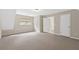 Another carpeted room featuring neutral walls, with window, doorway and closet at 4615 Gresham Rd, Douglasville, GA 30134