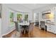 Charming breakfast nook with bay window, adjacent workstation, and parquet flooring at 4615 Gresham Rd, Douglasville, GA 30134