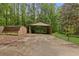 Open carport and storage shed, perfect for storing vehicles and garden equipment at 4615 Gresham Rd, Douglasville, GA 30134