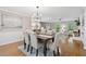 Elegant dining room with stylish lighting and wainscotting, ideal for Gathering gatherings at 4615 Gresham Rd, Douglasville, GA 30134