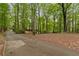 Long driveway leading to the house, surrounded by lush trees, offering privacy and tranquility at 4615 Gresham Rd, Douglasville, GA 30134