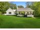 Charming single-story home featuring a well-manicured lawn, classic black and white trim, and a cozy front porch at 4615 Gresham Rd, Douglasville, GA 30134