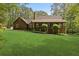 Charming single-Gathering home with a lush green lawn and inviting front porch at 4615 Gresham Rd, Douglasville, GA 30134