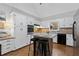 Bright kitchen features stainless steel appliances, stone countertops, and an island at 4615 Gresham Rd, Douglasville, GA 30134
