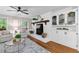 Inviting living room features a white fireplace and built-in cabinets for storage at 4615 Gresham Rd, Douglasville, GA 30134