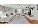 Bright living room featuring a decorative fireplace, hardwood floors, and neutral decor at 4615 Gresham Rd, Douglasville, GA 30134