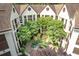 A captivating aerial view showcases the complex's unique architecture and the lush courtyard below at 476 Sherman Way, Decatur, GA 30033