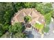 An aerial view of the house with green landscaping and several parking spaces at 476 Sherman Way, Decatur, GA 30033