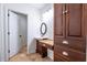 The bathroom has a modern vanity with granite countertop and a large linen closet at 476 Sherman Way, Decatur, GA 30033