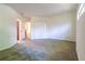 A neutral bedroom has neutral carpeting, a double closet, and is attached to the bathroom at 476 Sherman Way, Decatur, GA 30033