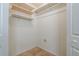 This closet has neutral tile floors, white walls, and shelving at 476 Sherman Way, Decatur, GA 30033