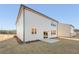 New construction home with minimal backyard patio space and limited lawn at 5599 Rosehall Pl, Atlanta, GA 30349