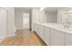 Bathroom featuring a double vanity, white countertops, and a separate glass shower at 5599 Rosehall Pl, Atlanta, GA 30349
