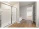 Bright bathroom with a glass enclosed shower and soaking tub at 5599 Rosehall Pl, Atlanta, GA 30349