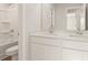 Modern bathroom featuring double vanity, white cabinetry, white quartz countertops and shower with tub at 5599 Rosehall Pl, Atlanta, GA 30349