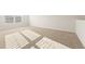 Upstairs area featuring neutral carpet and a window at 5599 Rosehall Pl, Atlanta, GA 30349