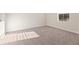 Neutral bedroom featuring neutral carpet, window, and plenty of natural light at 5599 Rosehall Pl, Atlanta, GA 30349