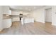 Bright kitchen with wood floors, white cabinets, and a central island at 5599 Rosehall Pl, Atlanta, GA 30349