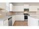 Modern kitchen featuring granite counters, stainless steel appliances, and backsplash at 5599 Rosehall Pl, Atlanta, GA 30349