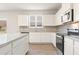 Modern kitchen featuring granite counters and stainless steel appliances at 5599 Rosehall Pl, Atlanta, GA 30349