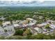 Aerial view of the surrounding neighborhood with shopping and dining destinations nestled among lush greenery at 120 Park Bridge Ln, Roswell, GA 30075