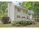 Home exterior features a deck, landscaping, and spacious backyard at 120 Park Bridge Ln, Roswell, GA 30075