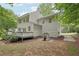 Home exterior showcasing deck, playhouse and spacious backyard at 120 Park Bridge Ln, Roswell, GA 30075