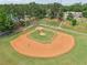 Aerial view of a baseball field with an orange infield and green outfield, providing a great recreational space at 120 Park Bridge Ln, Roswell, GA 30075