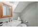 Charming half bath with marble countertop, vintage mirror, and decorative fixtures at 120 Park Bridge Ln, Roswell, GA 30075