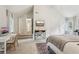 Bright bedroom featuring a cozy bed, dedicated workspace, and easy access to the hallway for a functional layout at 120 Park Bridge Ln, Roswell, GA 30075