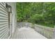Deck area featuring chairs, table and wooded view at 120 Park Bridge Ln, Roswell, GA 30075