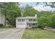 Charming two-story home with an attached garage and landscaped front yard at 120 Park Bridge Ln, Roswell, GA 30075
