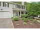 Well-maintained two-story home with lovely landscaping in the front yard at 120 Park Bridge Ln, Roswell, GA 30075