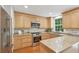 Bright kitchen featuring wooden cabinets, stainless steel appliances, and granite countertops at 120 Park Bridge Ln, Roswell, GA 30075