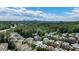 Aerial view of neighborhood, showing lush greenery and expansive city skyline at 1720 Buckhead Valley Ne Ln, Atlanta, GA 30324