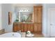 Bathroom vanity with granite counters, dual sinks, and ample cabinet space at 1720 Buckhead Valley Ne Ln, Atlanta, GA 30324