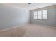 Spacious bedroom with neutral paint, carpet, and natural light from the window at 1720 Buckhead Valley Ne Ln, Atlanta, GA 30324