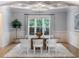 Elegant dining room features a modern glass table, designer chairs, and sophisticated decor at 1720 Buckhead Valley Ne Ln, Atlanta, GA 30324