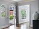 Inviting foyer with arched doorway, hardwood floors, and natural light at 1720 Buckhead Valley Ne Ln, Atlanta, GA 30324