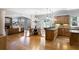 Open kitchen with granite countertops, custom cabinetry, and seamless flow into the dining and living areas at 1720 Buckhead Valley Ne Ln, Atlanta, GA 30324