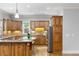 Spacious kitchen features wooden cabinetry, stainless steel appliances and a granite countertop island with breakfast bar at 1720 Buckhead Valley Ne Ln, Atlanta, GA 30324